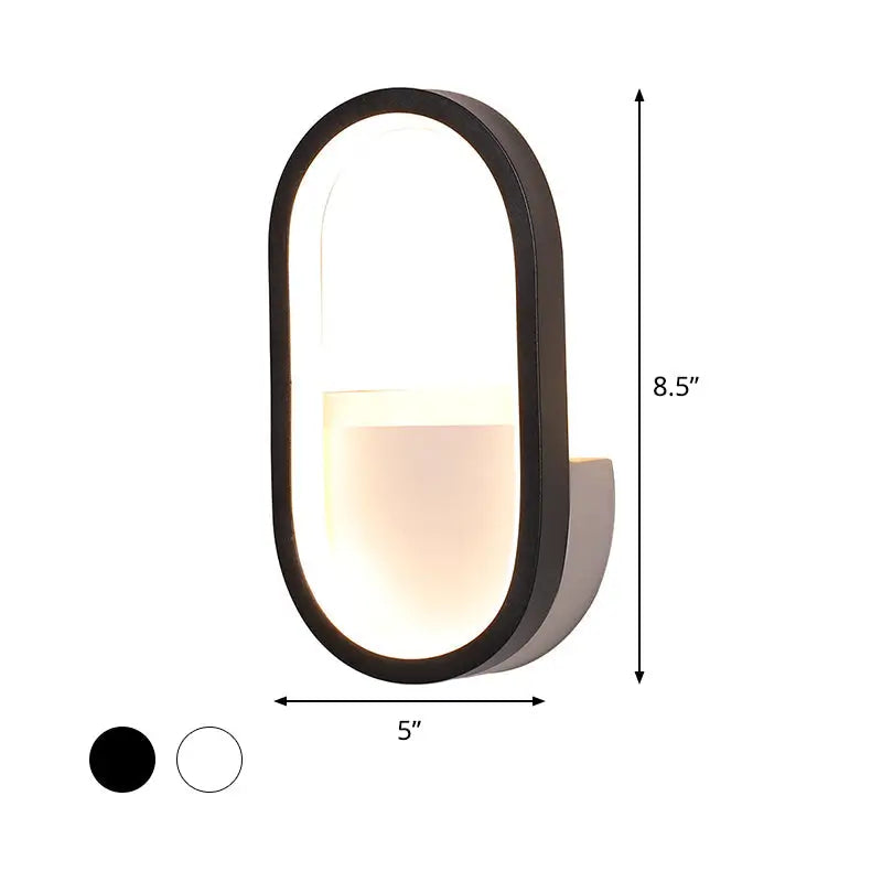 Modern black-framed oval wall lamp with warm white led light diffuser ideal for bedroom lighting