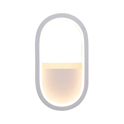 Modern white and black ellipse led wall lamp with a sleek gray frame and warm white light for bedroom use