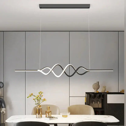 Modern white and black living chandelier lights with sleek wave-like led pendant design above dining table