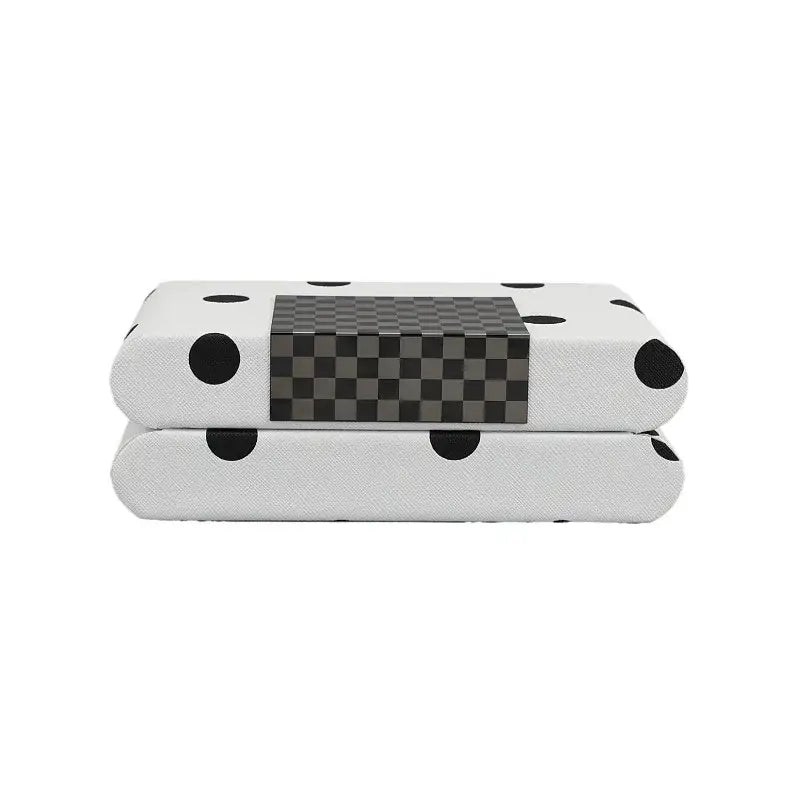 Modern white and black polka dot leather storage box with a central gray checkered panel for bedroom organization
