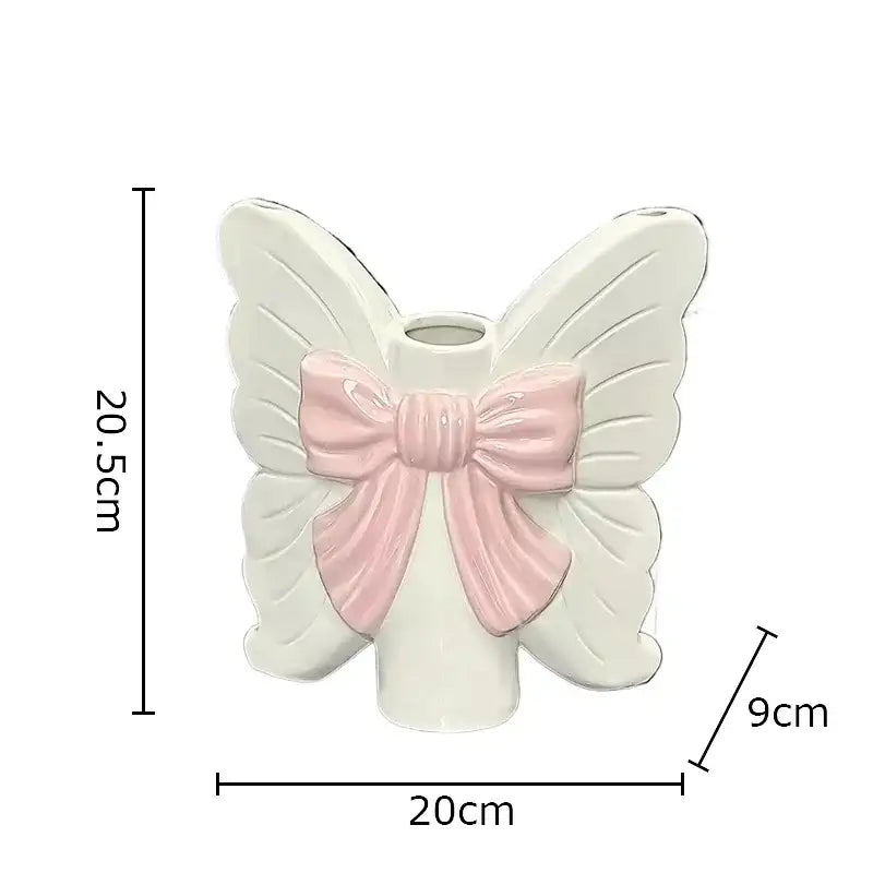 Modern white butterfly ceramic vase with pink bow featuring delicate design for bedroom decorbites butterfly ceramic use