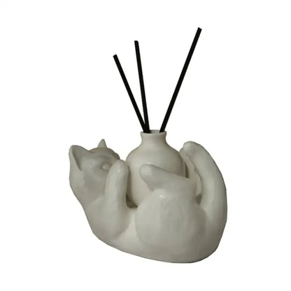 Modern white ceramic cat cartoon vase diffuser base shaped like two embracing cats with black reed sticks decorbites cat