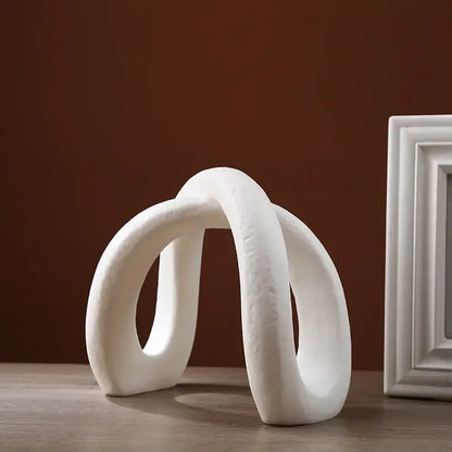 Modern white ceramic infinity symbol sculpture with smooth curves for decorbites infinity symbol living room decor