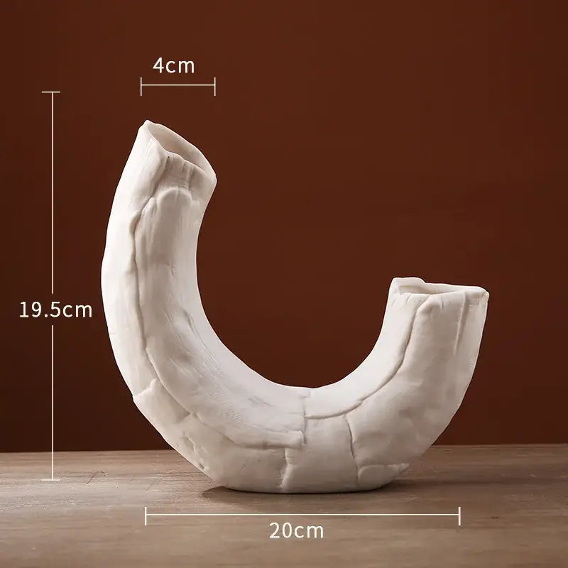 Modern white ceramic infinity symbol vase with textured cracked surface and two open ends by decorbites infinity