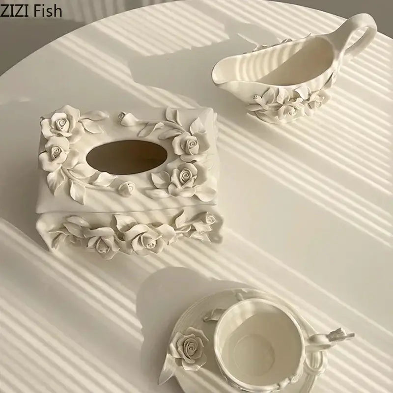 Modern white ceramic tissue box with raised camellia flower detailing for living room use