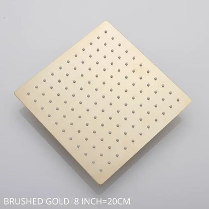 Modern white chrome rainfall shower head with brushed gold square design and evenly spaced perforations for rainfall shower