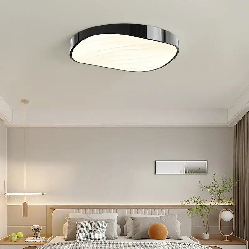 Modern black and white circular chandelier with sleek oval design and wave texture for dining room decorbites circular chandelier