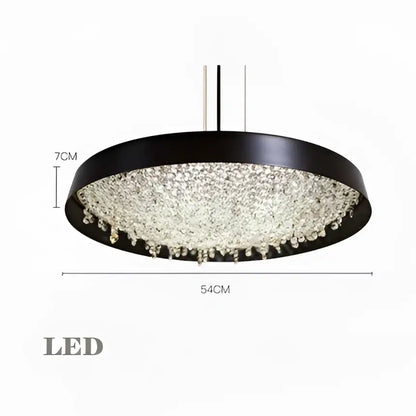 Modern black circular pendant light with clear crystal pendant droplets by decorbites for living room decor