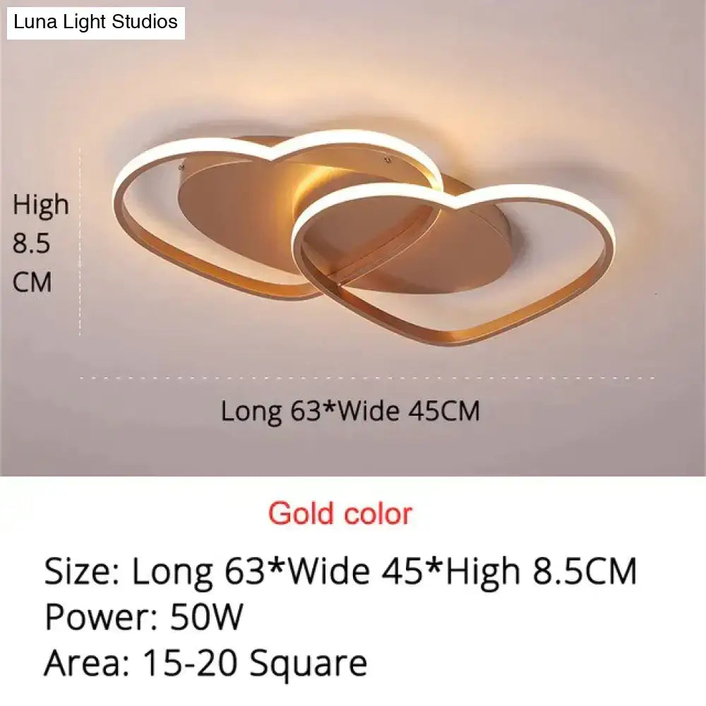 Gold-colored led pendant light with two interlocking heart-shaped frames for modern white coffee bedroom decor