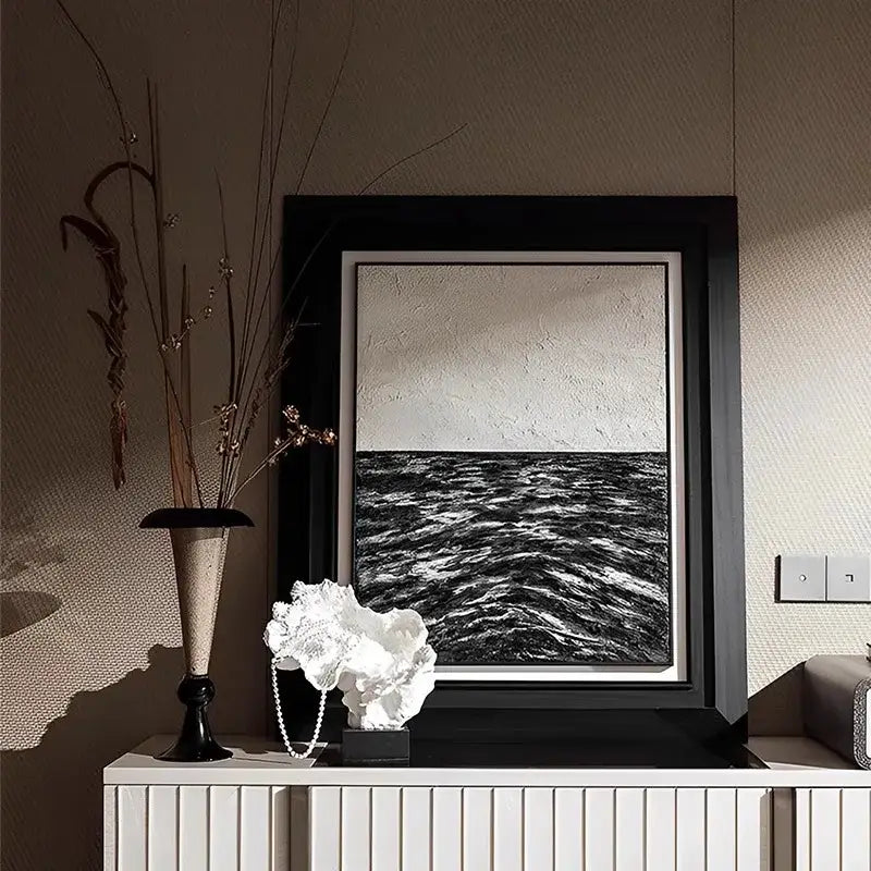 Black-framed abstract painting with textured monochromatic waves and sky complements decorbites coral tree resin home decor