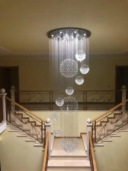 A modern white decorbites crystal ball chandelier with cascading spherical clusters for staircase living room light