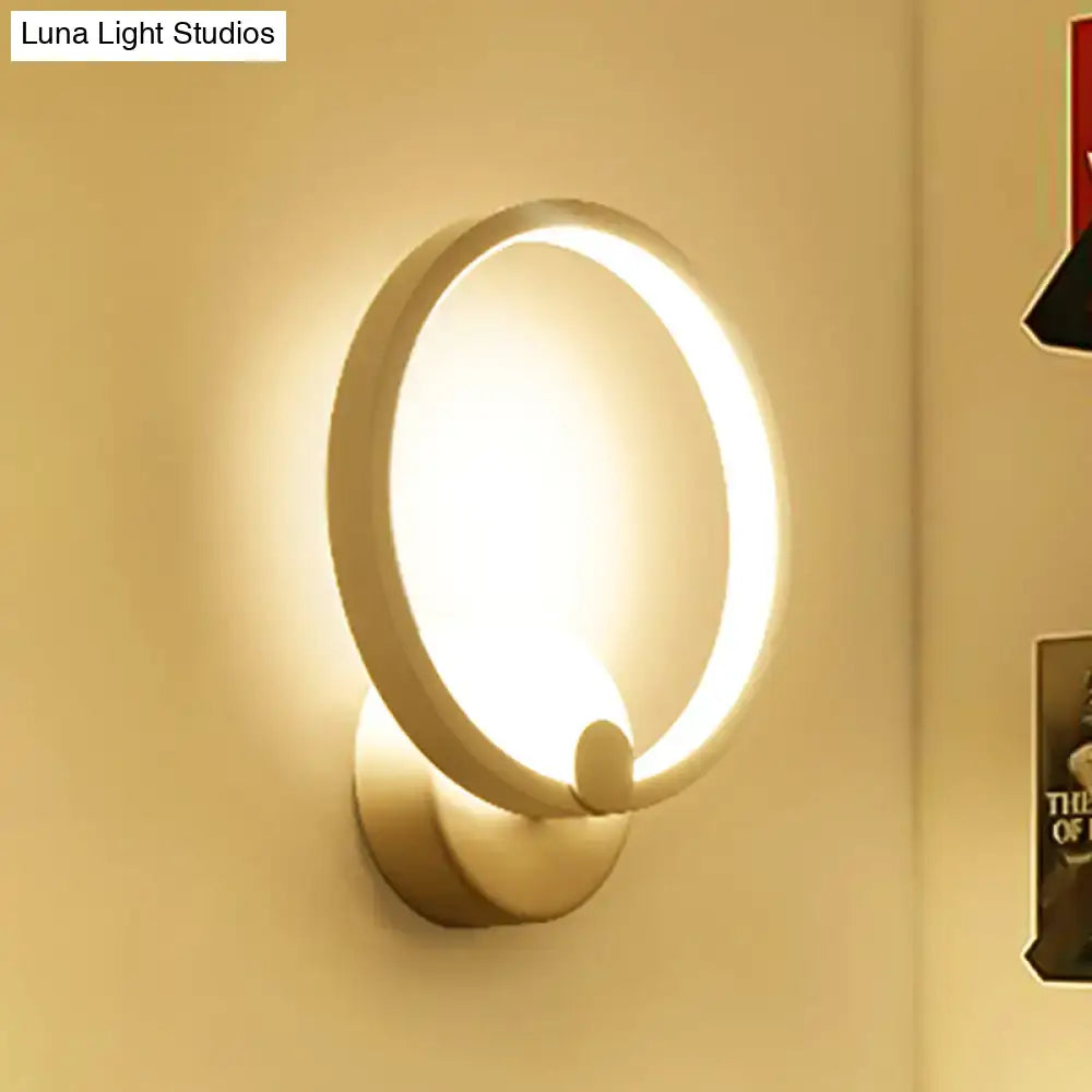 Modern white curved led wall lamp with a warm glowing ring and minimalist metallic finish for bedroom lighting wall lamp light type