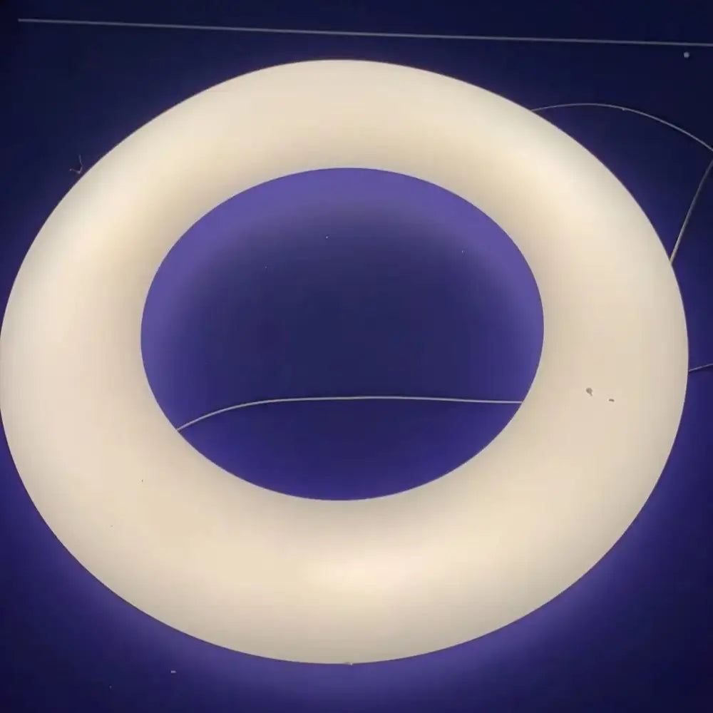 Modern white and dark gray cloud pendant light featuring a cream-colored circular ring light with a smooth matte finish