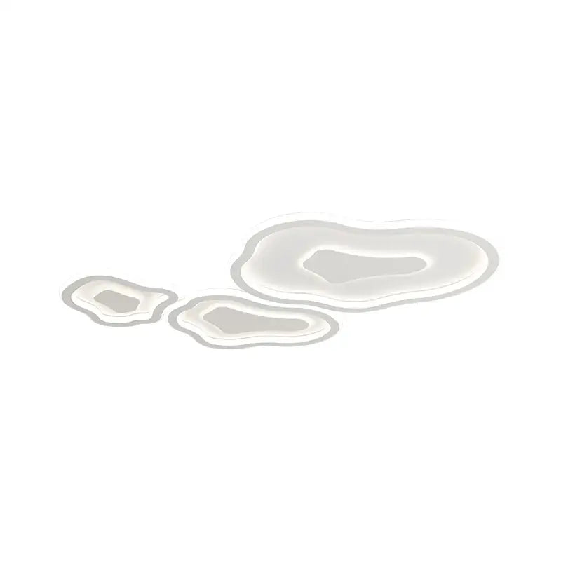 Three translucent irregular puddles with glossy surface and grayish undertones in modern white decorbites cloud chandelier