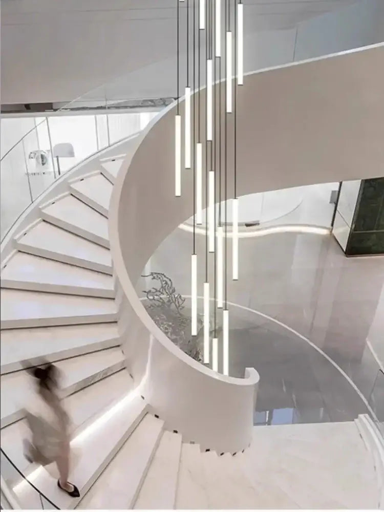 Modern white duplex loft led chandelier with sleek cylindrical tubes in a cascading stairway pendant light decorbites duplex loft