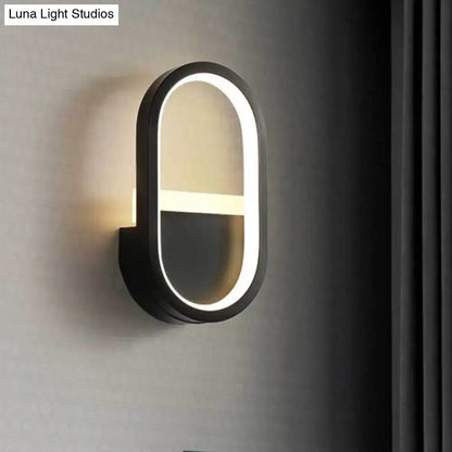 Modern black elliptical led wall lamp with glowing white led ring and horizontal light bar for bedroom sconce use