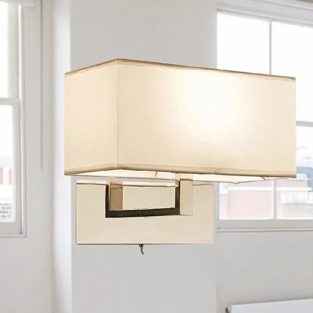 Modern white fabric wall sconce with cream fabric shade and polished brass frame for bedroom wall light