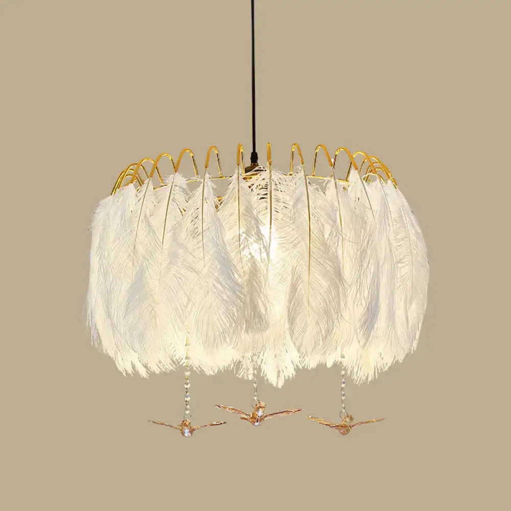 Modern white feather chandelier with gold-toned wire frame and dangling bird ornaments for living room pendant light