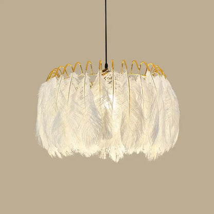 Modern white feather chandelier with gold wire frame designed as a living room pendant light fixture