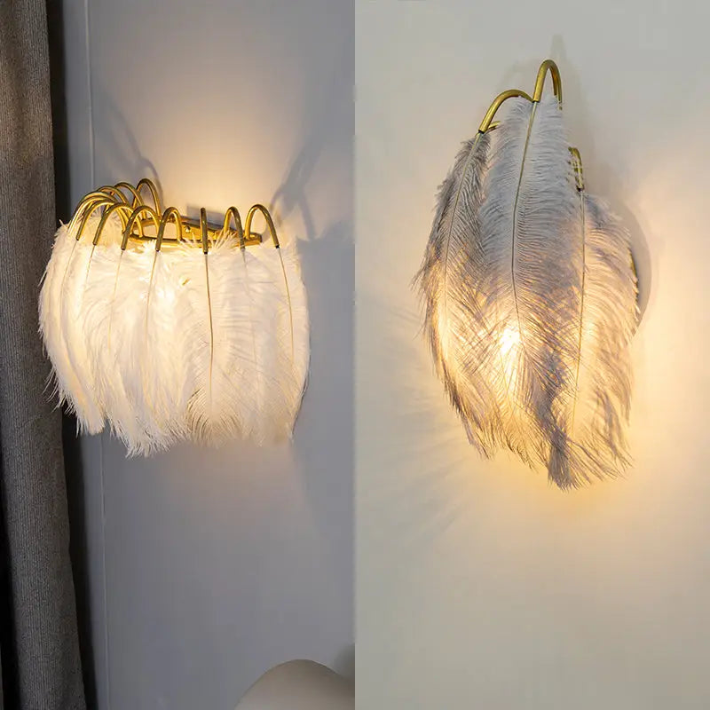 Modern metal wall sconce featuring white feather design with gold-toned metal frame for bedroom lighting