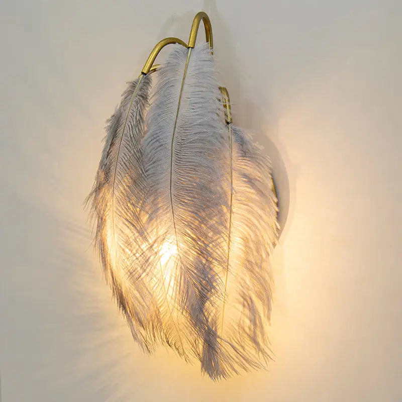Modern white feather metal wall sconce with gold-toned frame for bedroom lighting modern metal wall decor
