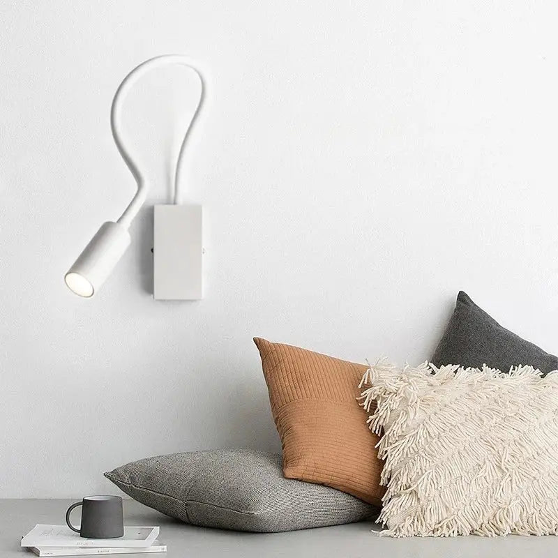 Modern white minimalist wall spot light with flexible gooseneck arm and cylindrical light head for bedroom reading