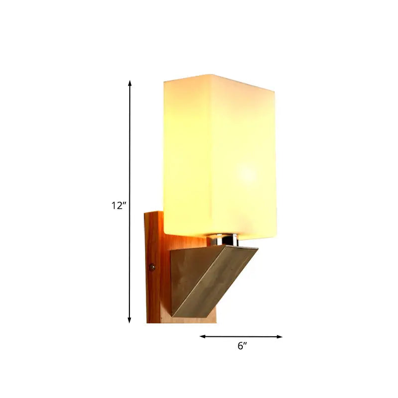 Modern wall lamp with warm-toned rectangular white frosted glass mounted on wood and metal base for bedroom use