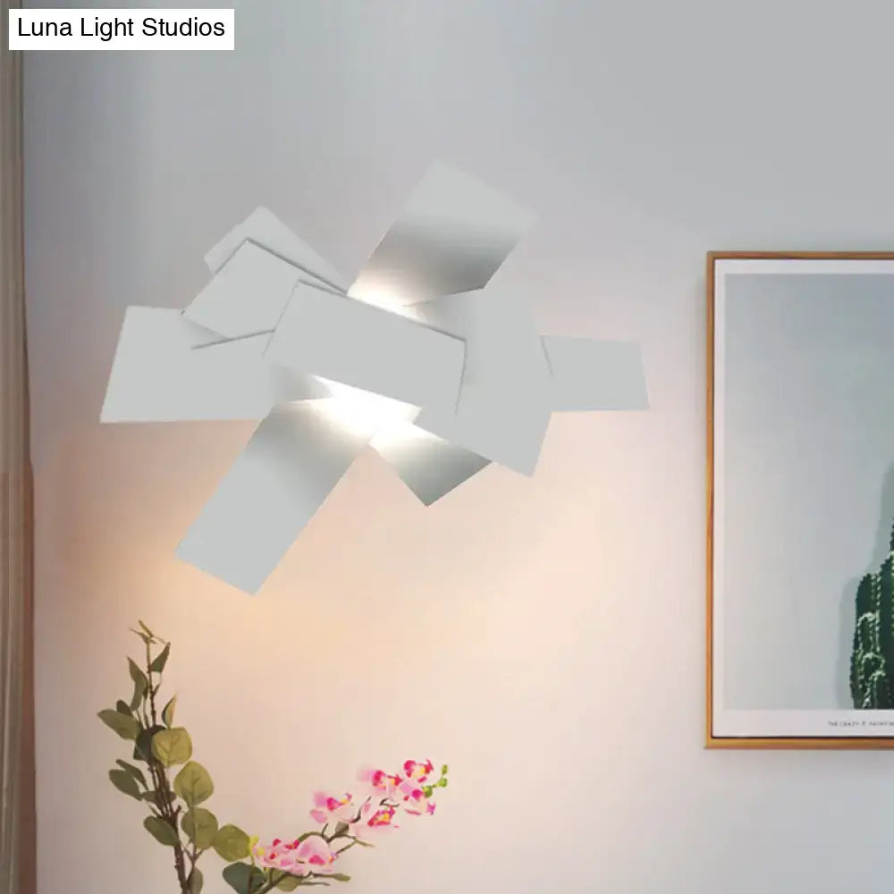 Modern white geometric ceiling light with layered angular panels warm glow 110v-120v bulb base for bedroom use