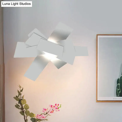 Modern white geometric ceiling light with layered angular panels warm glow 110v-120v bulb base for bedroom use