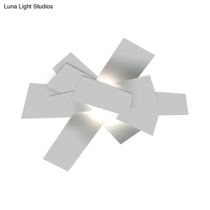 Modern white geometric ceiling light with overlapping rectangular panels and 110v-120v bulb base for bedroom use