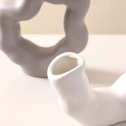 Modern white geometric ceramic flower vase with smooth abstract organic shape for living room decorbites decor