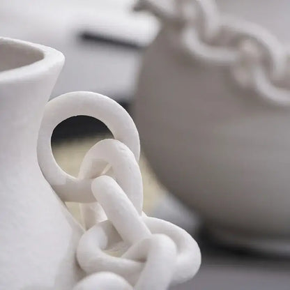 Modern white ceramic vase with a sculpted geometric chain porcelain handle for decorbites geometric chain decor