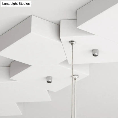 Modern white geometric led island light with sleek chrome fixtures and minimalist design for kitchen or living room