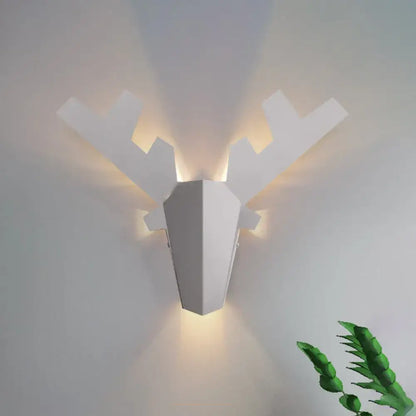 Modern white geometric reindeer wall lamp featuring a warm directional light type for bedroom sconce use