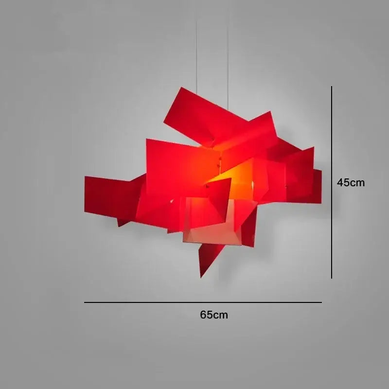 Vibrant red geometric pendant lamp with angular layered panels casting a warm glow decorbites big bang stacking design