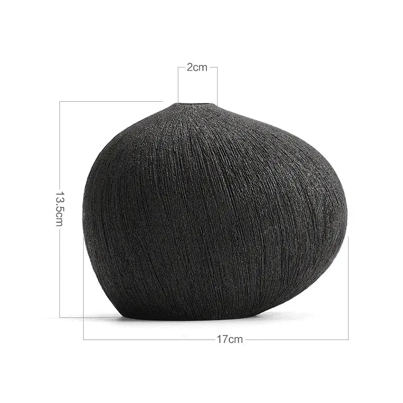Black textured ceramic vase with rounded body and narrow neck for modern white geometric stripes decorbites ceramic decor