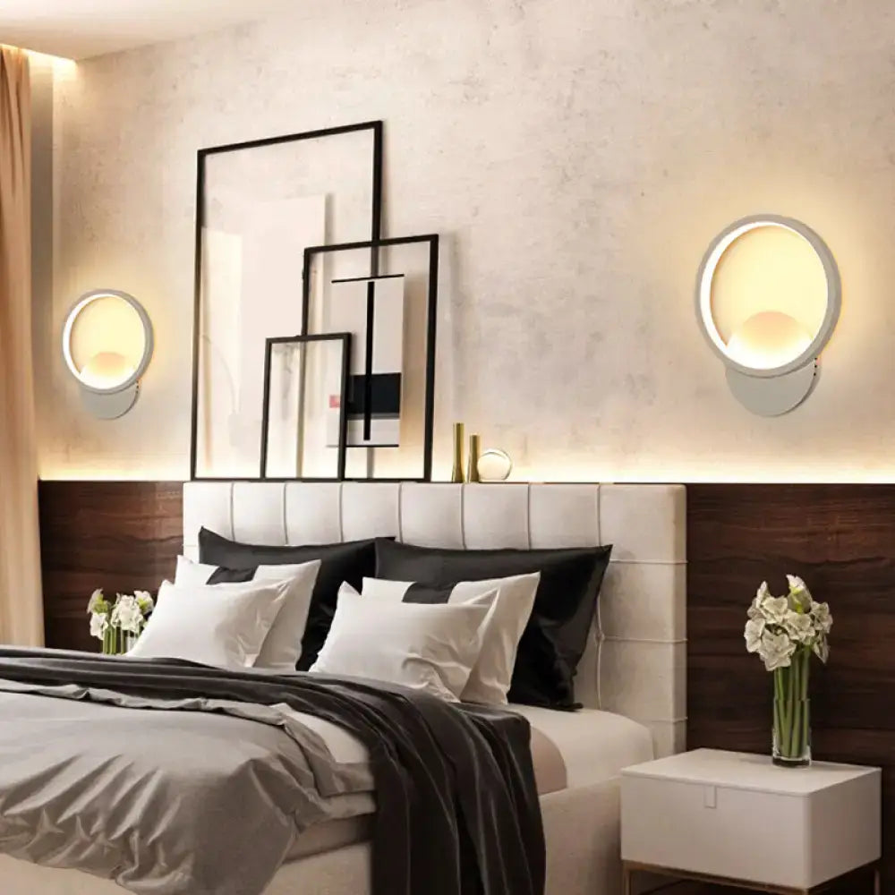 Modern white geometric twisted led wall lamp with sleek metallic frame and warm diffused light for stairway use