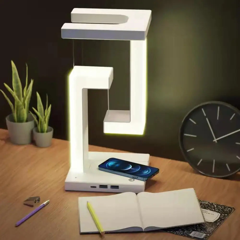 Modern white geometric wireless charger desk lamp with illuminated edges and built-in charging ports for bedroom use