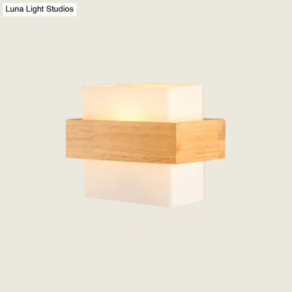 Modern white glass and wood wall light with a warm rectangular acrylic light fixture for bedroom use