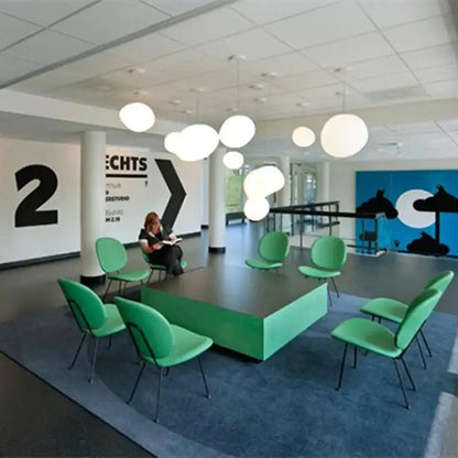 Modern white glass ball led pendant light dining room set with mint green upholstered chairs and black metal frames