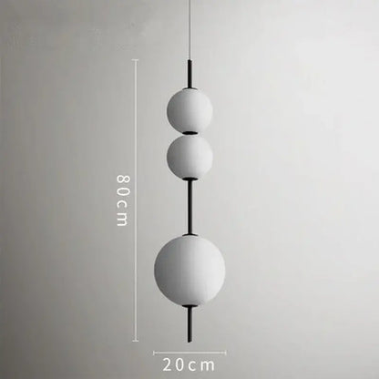 Modern white glass ball led pendant light with three matte white glass globes and black rods for kitchen and dining decorbites glass ball