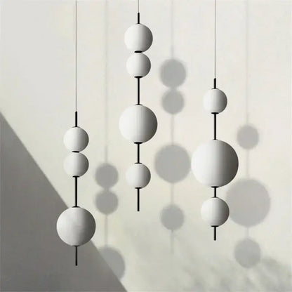 Modern white glass ball led pendant light with black rods for kitchen and dining room decorbites glass ball design