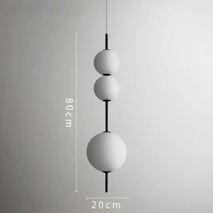 Modern white glass ball led pendant light with black central rods and 80cm length for kitchen and dining room decorbites