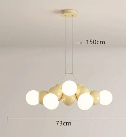 Modern white glass globe pendant light fixture with glossy cream and white spherical bulbs for dining room use