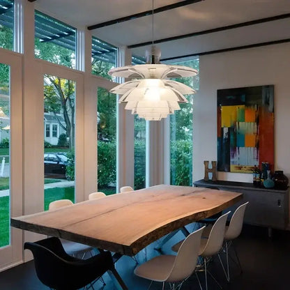 Modern white glass pine cone pendant chandelier with layered petal design hanging above dining table
