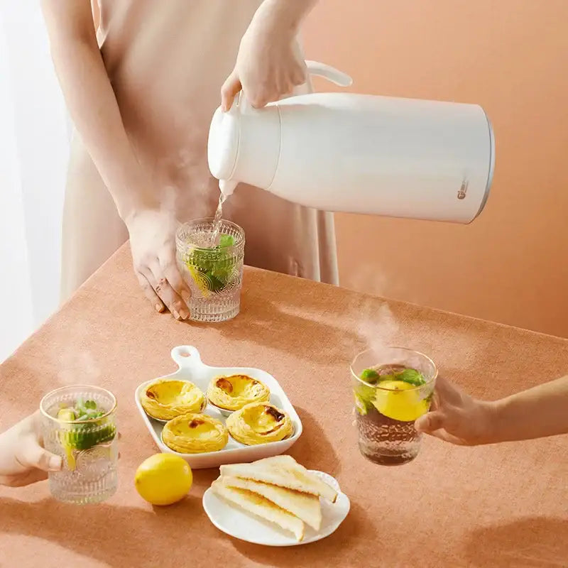 Modern white glossy ceramic thermal carafe with sleek design and handle for easy pouring decorbites glass insulation kettle