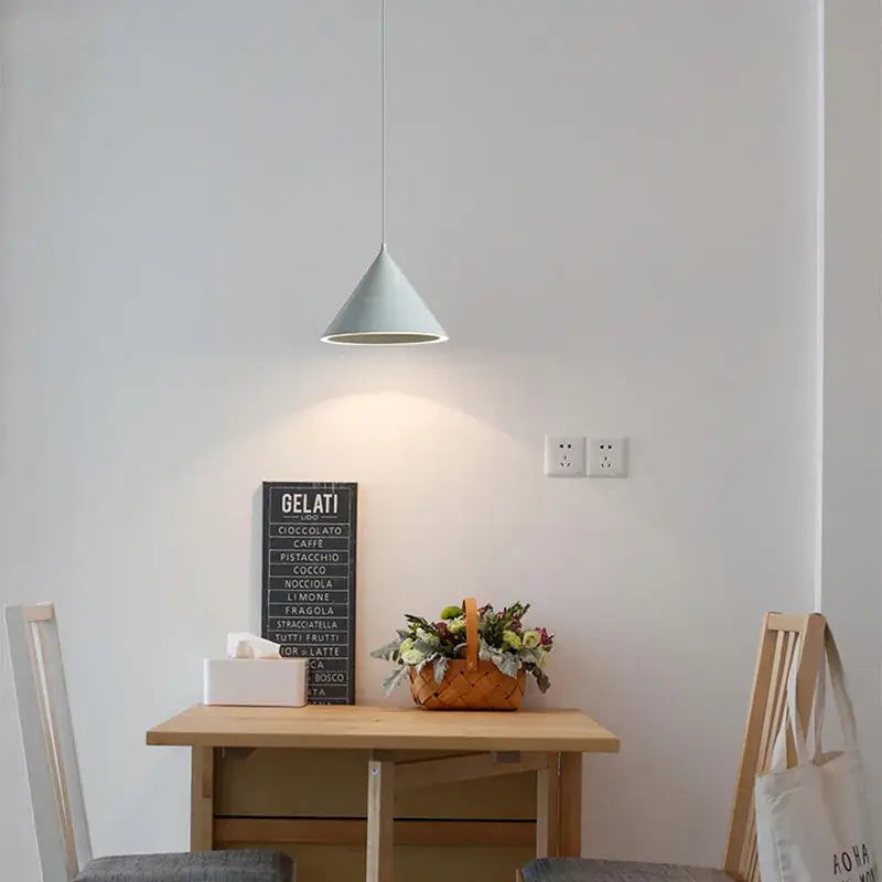 A minimalist modern white and gold annular cone pendant lamp with a smooth matte finish for living room decorbites pendant lamp