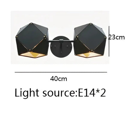 Black geometric dual-light wall sconce with gold-toned interior accents complements decorbites cube led pendant light