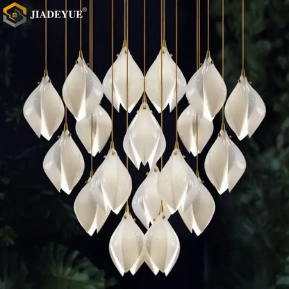 Elegant white ceramic led staircase pendant light with gold-toned accents and modern leaf design by decorbites ceramic led