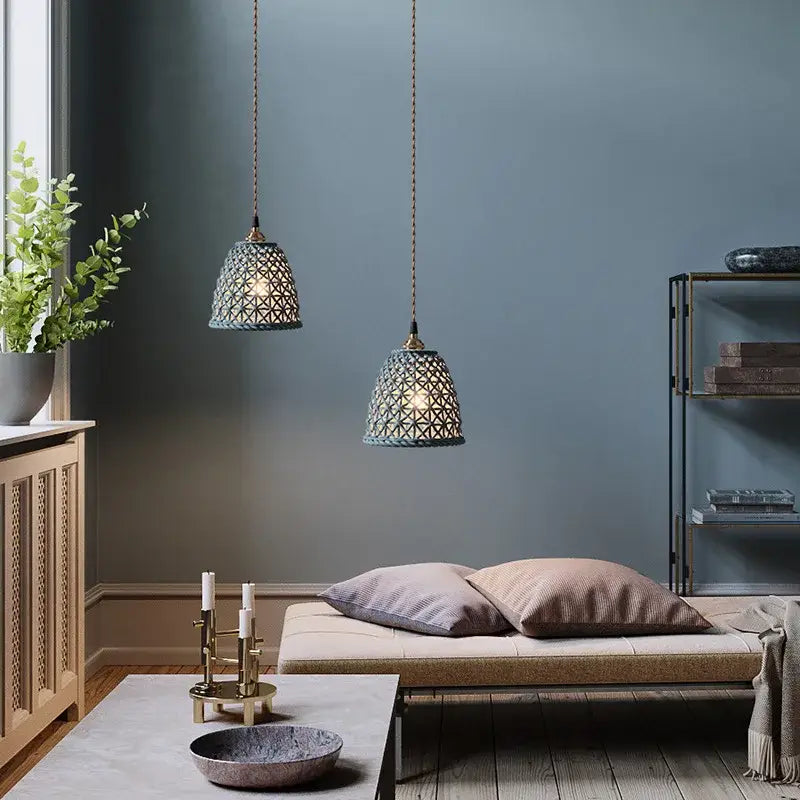 Two muted teal decorbites ceramic led pendant lights with intricate geometric lattice design for dining room decor